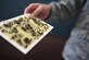 Senior Airman Cory, a 49th Civil Engineer Squadron pest management specialist, holds an insect sticky trap filled with dozens of bugs at Holloman Air Force Base, N.M., on July 7. Pest management specialists look for cracks, crevices and openings in which bugs or animals could access facilities and identify any sanitation issues that could be causing problems. (Last names are being withheld due to operational requirements. U.S. Air Force photo by Staff Sgt. Eboni Prince)