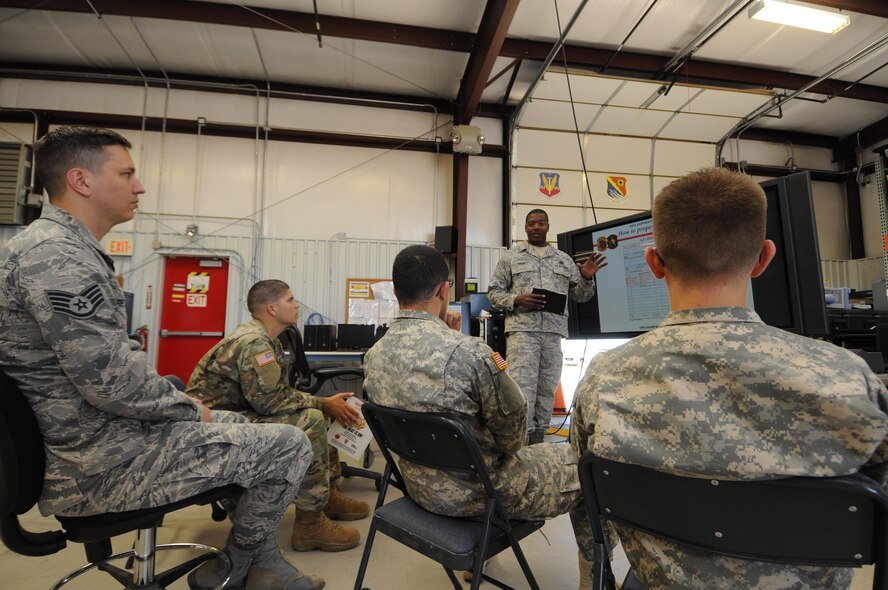 Master Sgt. James Frison teaches Air Force and Army personnel how to operate ground mobile vehicles inside the 527th Space Aggressors Squadron’s facility at Schriever Air Force Base, Colorado, Tuesday, July 11, 2016. The squadron supports and trains Army, Navy and internationally with other military forces to deal with GPS testing and satellite communication jamming. (U.S. Air Force photo/2nd Lt. Darren Domingo)