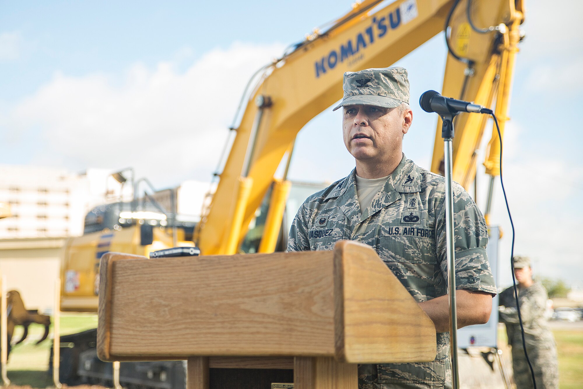 Col. Ernest Vasquez, 433rd Medical Group commander, delivers a speech during the ground breaking ceremony at the future site of the  433rd Medical Group Consolidated Training Facility July 14, 2016 at Joint Base San Antonio-Lackland, Texas. This new building will be a two-story, 36,560-square-feet facility that will combine 433rd Medical Group units who have been previously displaced across JBSA-Lackland. (U.S. Air Force photo by Benjamin Faske) 
