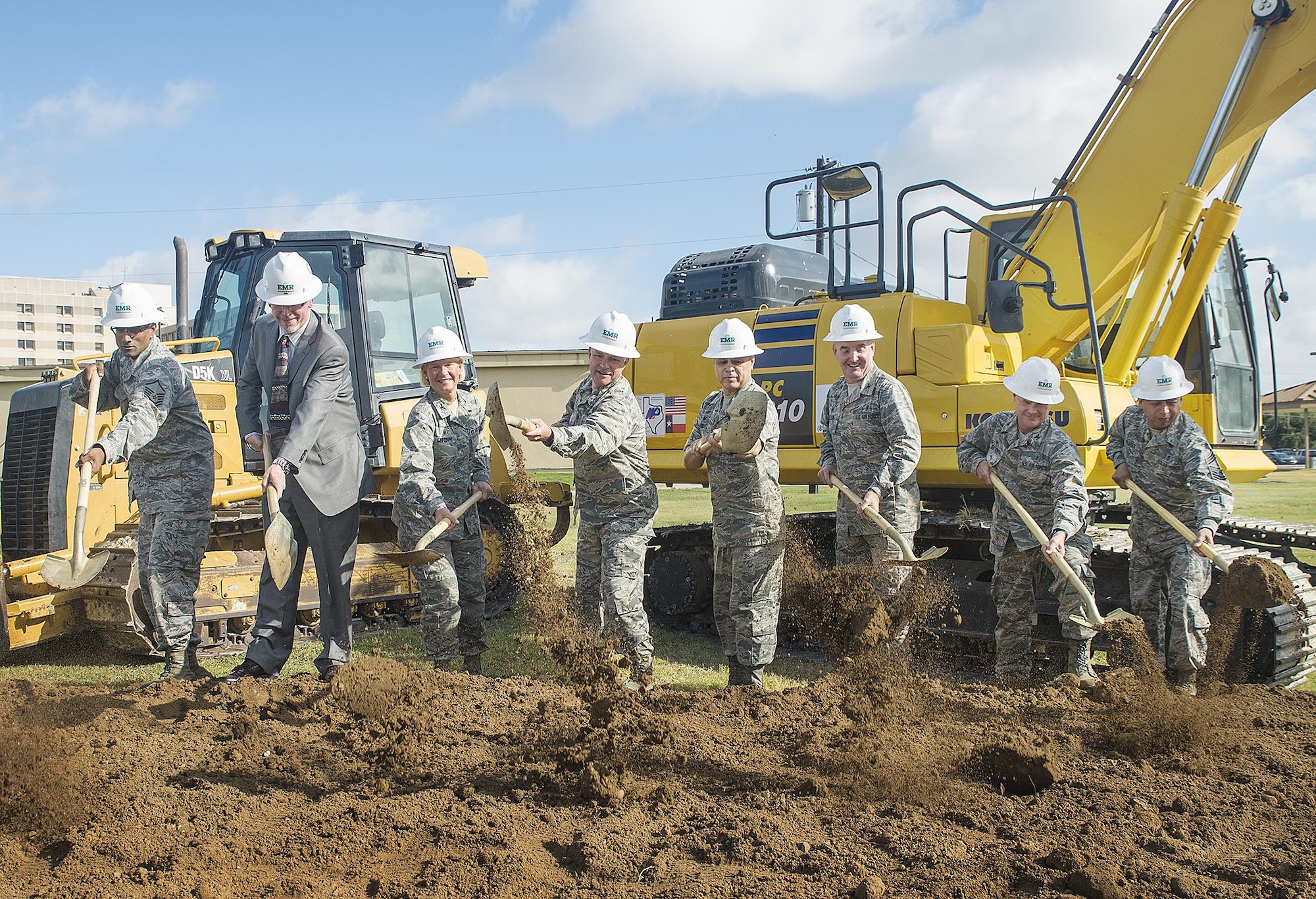 (From left) Master Sgt. Vincent Chandrabose, 433rd Medical Group project manager, Mike Gross, EMR Inc chief operating officer, Col. Rachel Lefebvre, 59th Medical Wing vice commander, Col. David Scott, 433rd Airlift Wing vice commander, Col. Ernest Vasquez, 433rd Medical Group commander, Col. Mike Nelson, 433rd Medical Squadron commander, Col. Gregg Wentworth, 433rd Aeromedical Staging Squadron commander, Chief Master Sgt. Ernesto Flores, 433rd Medical Group superintendent,  perform the ceremonial first dig at the future site of the 433rd Medical Group Consolidated Training Facility July 14, 2016 at Joint Base San Antonio-Lackland, Texas. This new building will be a two-story, 36,560-square-feet facility that will combine 433rd Medical Group units who have been previously displaced across JBSA-Lackland. (U.S. Air Force photo by Benjamin Faske)