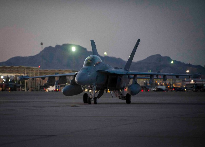 An Navy EA-18G from Naval Air Station Whidbey Island, Washington, cruises down the Nellis Air Force Base, Nev. flightline after returning from a training sortie during Red Flag 16-3 July 13. During the exercise, the EA-18G is able to perform electronic warfare in support of air and ground forces. (U.S. Air Force photo by Senior Airman Jake Carter)