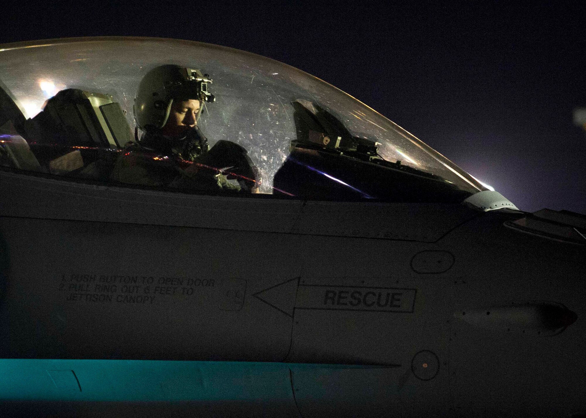 A pilot from the 20th Fighter Wing, Shaw Air Force Base, S.C., goes over pre-flight checks on his F-16 before taking off for a night sortie during Red Flag 16-3 July 13. Red Flag exercises train Airmen in Air, Space and Cyberspace to better prepare them for future operations. (U.S. Air Force photo by Senior Airman Jake Carter)