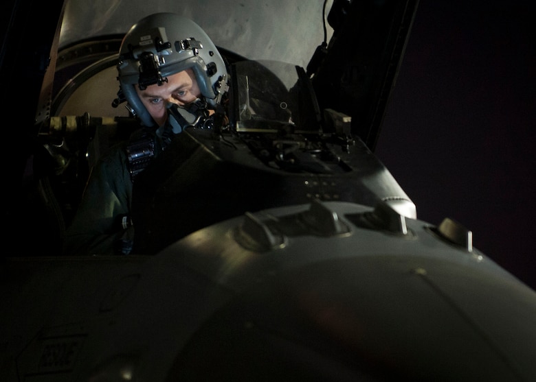Capt. Matt Bender from the 20th Fighter Squadron, Shaw Air Force Base, S.C., conducts pre-flight checks on his F-16 before a night sortie during Red Flag 16-3 July 13. Red Flag is a realistic combat training exercise involving the air forces of the United States and its allies is conducted on the vast bombing and gunnery ranges of the Nevada Test and Training Range. (U.S. Air Force photo by Senior Airman Jake Carter)