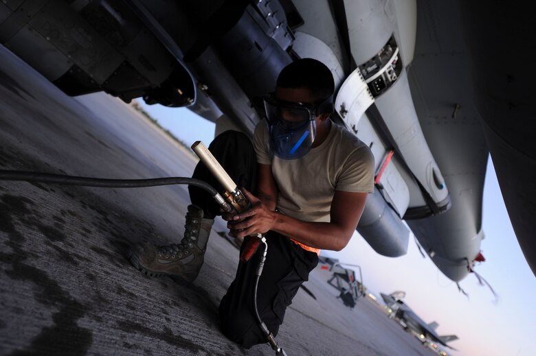 Senior Airman Josh Martinez, a maintainer assigned to 20th Aircraft Maintenance Squadron, Shaw Air Force Base, S.C., performs preventative maintenance tasks on an F-16 CJ prior to a Red Flag 16-3 night training mission July 13, 2016 at Nellis AFB, Nev. Maintainers are responsible for overseeing the day-to-day maintenance of aircraft, including diagnosing malfunctions and replacing components, and conducting various inspections to ensure the aircraft is functioning properly. (U.S. Air Force photo by Senior Airman Joshua Kleinholz/Released)
