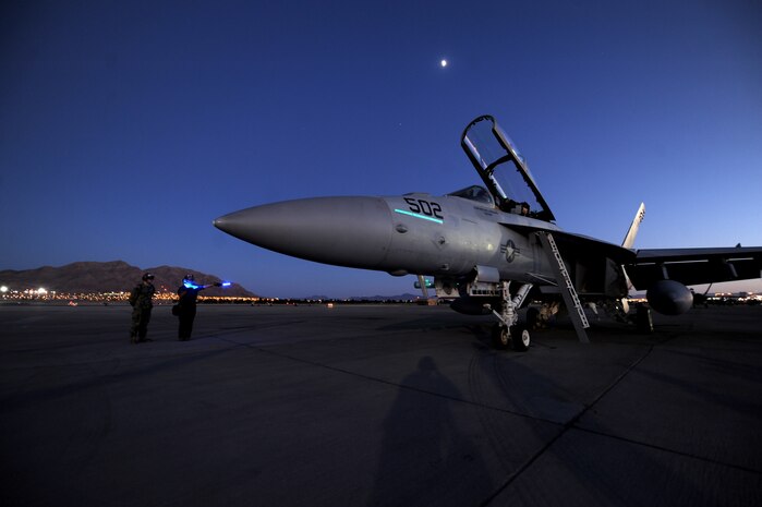 Maintainers assigned to Electronic Attack Squadron-209, EA-18G, NAS Whidbey Island,
Washington, standby to recover and assist the aircrew of an EA-18G Growler after completion of a Red Flag 16-3 training sortie July 13, 2016 at Nellis AFB, Nev. A typical Red Flag exercise involves a variety of attack, fighter and bomber aircraft, reconnaissance aircraft, electronic warfare aircraft, air superiority aircraft, airlift support, search and rescue aircraft, aerial refueling aircraft, command and control aircraft, as well as ground based command and control, space, and cyber forces. (U.S. Air Force photo by Senior Airman Joshua Kleinholz/Released)
