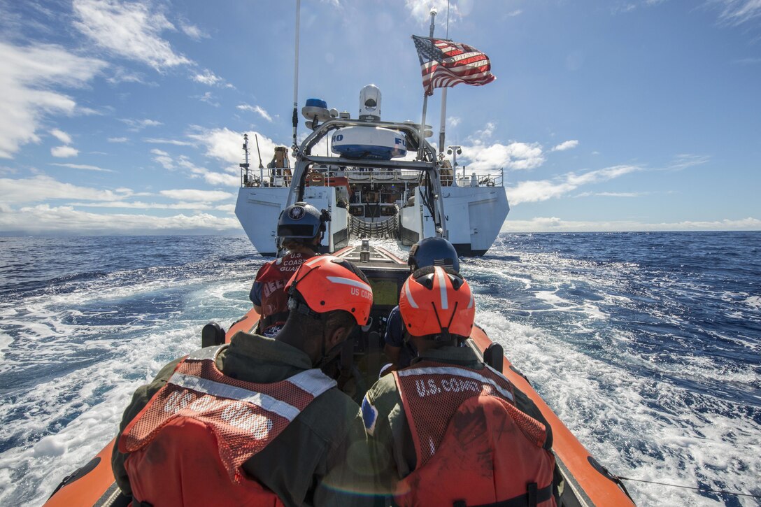 Coast Guard Cutter Stratton's crewmembers aboard a small boat return to the Stratton after a humanitarian assistance/disaster relief event for Rim of Pacific Exercise 2016, the world's largest international maritime exercise, in the Pacific Ocean, Hawaii, July 13, 2016. Twenty-six nations are participating in the exercise in Hawaii and Southern California. Coast Guard photo by Petty Officer 3rd Class Loumania Stewart