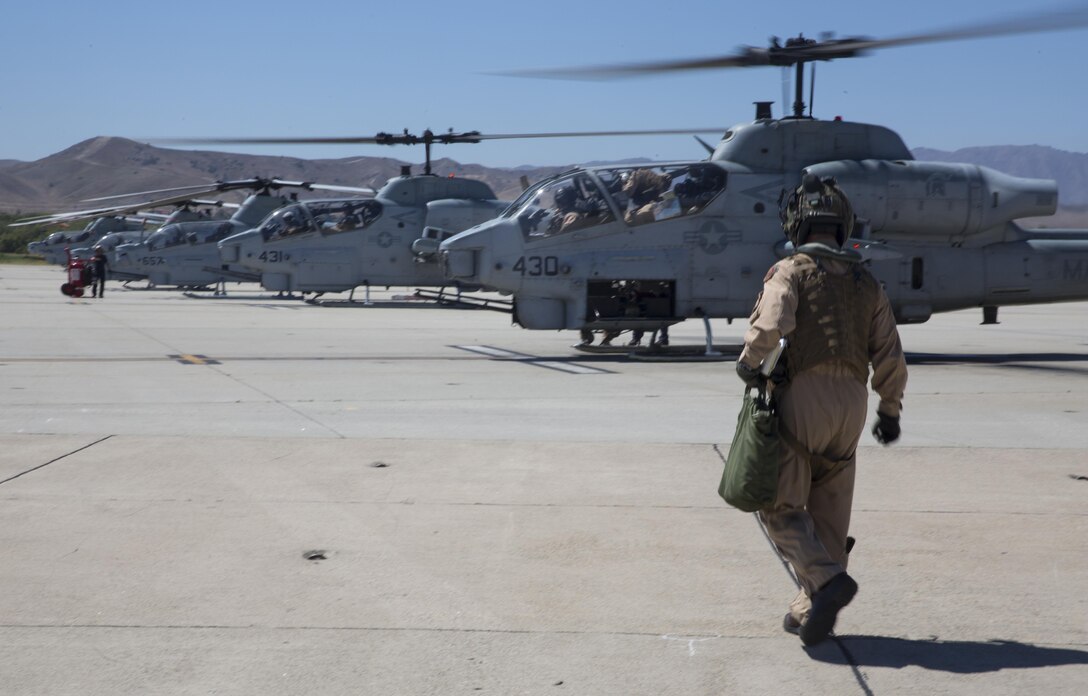 Maj. Gen. Michael Rocco, commanding general of 3rd Marine Aircraft Wing, heads to an AH-1W Super Cobra to begin his last flight aboard Marine Corps Air Station Camp Pendleton, Calif., July 7, 2016. Rocco took command of 3rd MAW in June 2014 and is slated to relinquish command to Maj. Gen. Mark Wise on July 22, 2016. (U.S. Marine Corps photo by Pfc. Jake McClung/Released)