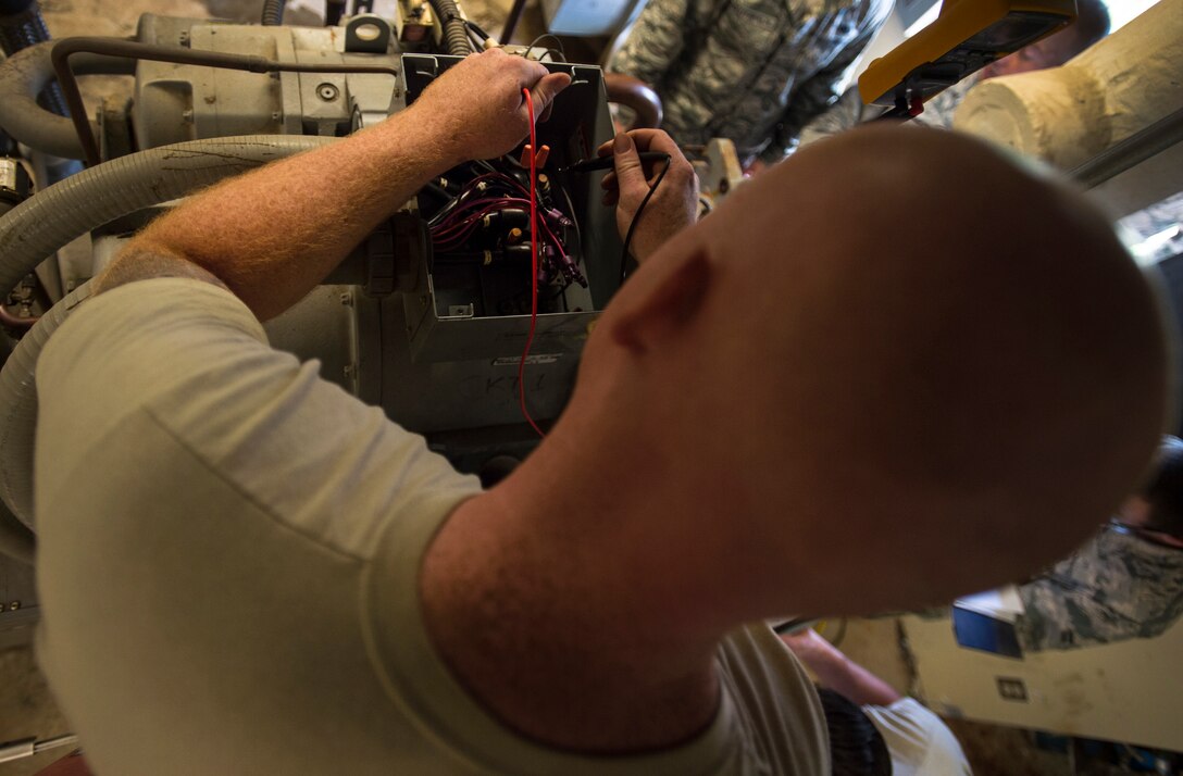 Staff Sgt. Ben Levalley, 11th Civil Engineer Squadron HVAC journeyman, repairs an air conditioning unit at the Child Development Center Three on Joint Base Andrews, Md., July 13, 2016. The HVAC flight cares for approximately 2,400 air conditioning units throughout JBA. (U.S. Air Force photo by Senior Airman Mariah Haddenham)
