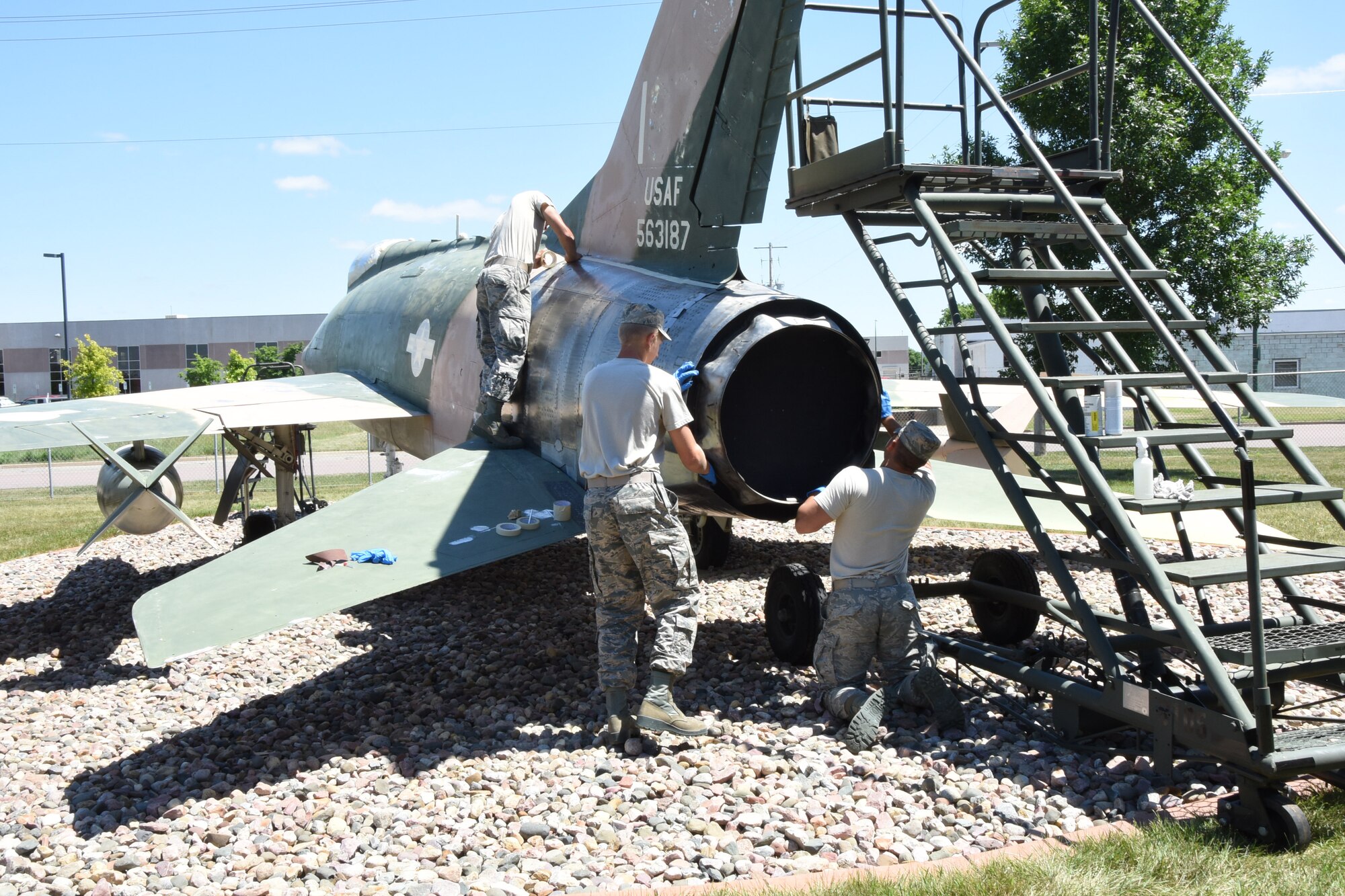 SIOUX FALLS, S.D. - Five Airmen from the 114th Maintenance Group are taking on the task of giving the static displays at Joe Foss Field, S.D. new life this year as they sand and repaint the old aircraft that are a part of the unit's great heritage.(U.S. Air National Guard photo by Senior Master Sgt. Nancy Ausland/released)
