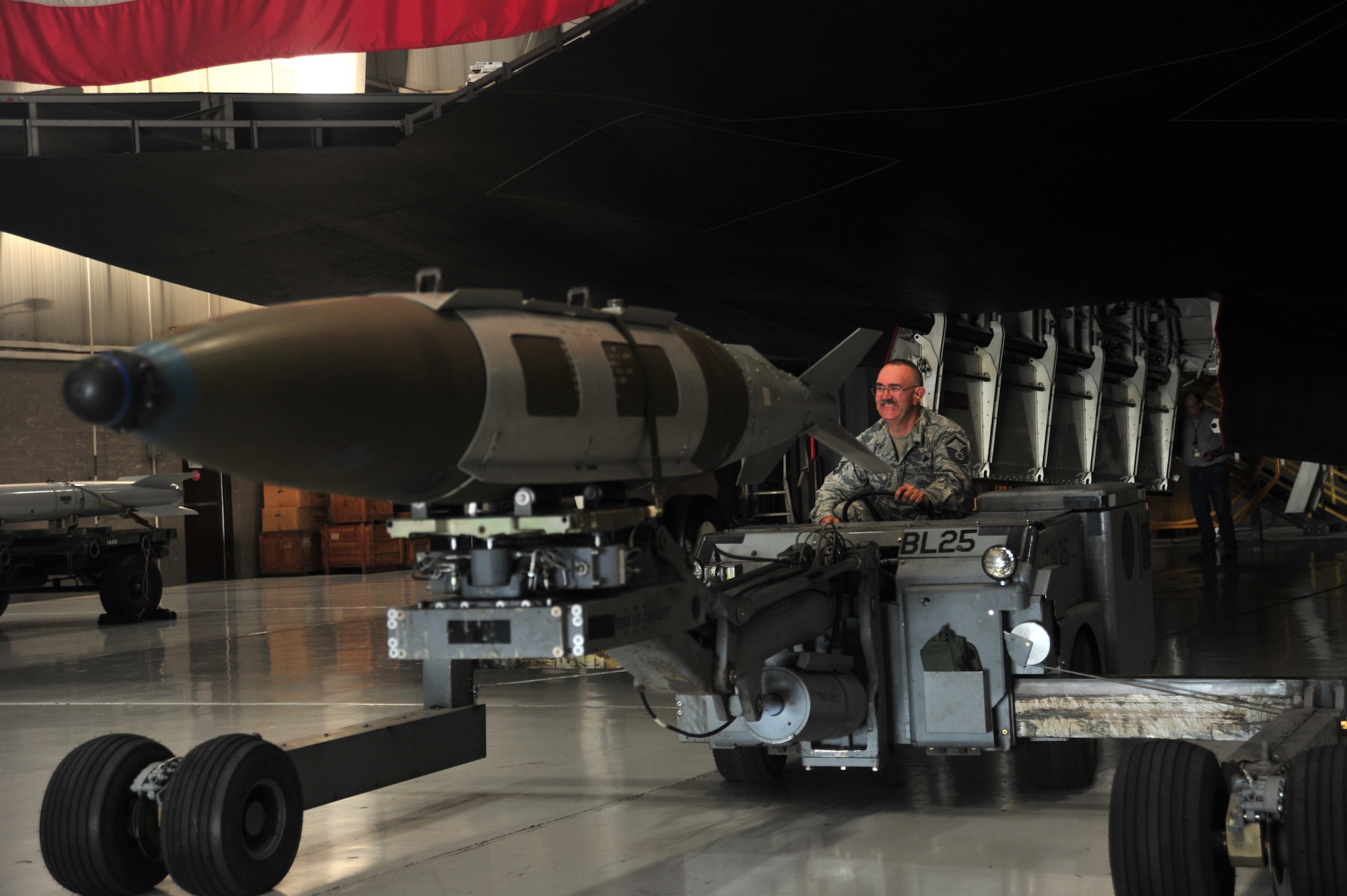 U.S. Air Force Master Sgt. Allen Anderson, an aircraft armament systems mechanic assigned to the 131st Aircraft Maintenance Squadron, operates an MHU-83 D/E jammer  during certification training at Whiteman Air Force Base, Mo., June 28, 2016. Anderson, after serving more than 20 years in the Air Force, decided to end his career how it began, as a weapons loader.  (U.S. Air Force photo by Senior Airman Jovan Banks)