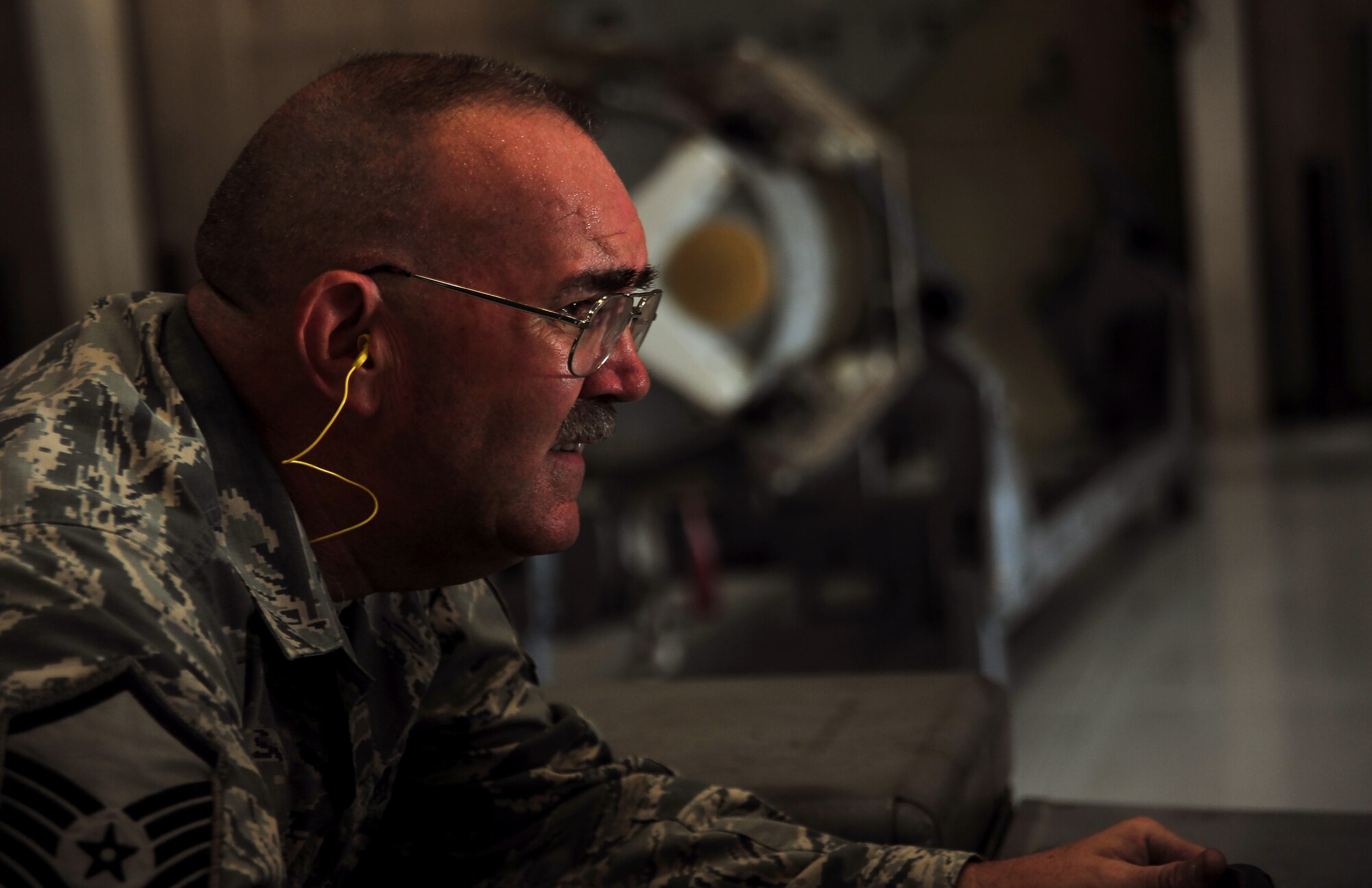 U.S. Air Force Master Sgt. Allen Anderson, an aircraft armament systems mechanic assigned to the 131st Aircraft Maintenance Squadron, loads a GBU–31 version 1 trainer munition during certification training at Whiteman Air Force Base, Mo., June 28, 2016. Anderson holds the four man role on his load crew team, which gives him control of the jammer during munition loads. (U.S. Air Force photo by Senior Airman Jovan Banks)
