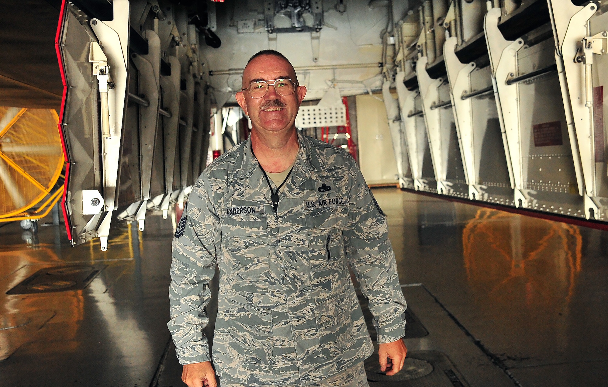 U.S. Air Force Master Sgt. Allen Anderson, an aircraft armament systems mechanic assigned to the 131st Aircraft Maintenance Squadron, smiles after successfully completing steps for his certification training at Whiteman Air Force Base, Mo., June 28, 2016. Anderson is certified to load various munitions and now holds the four man role on his load crew. (U.S. Air Force photo by Senior Airman Jovan Banks)