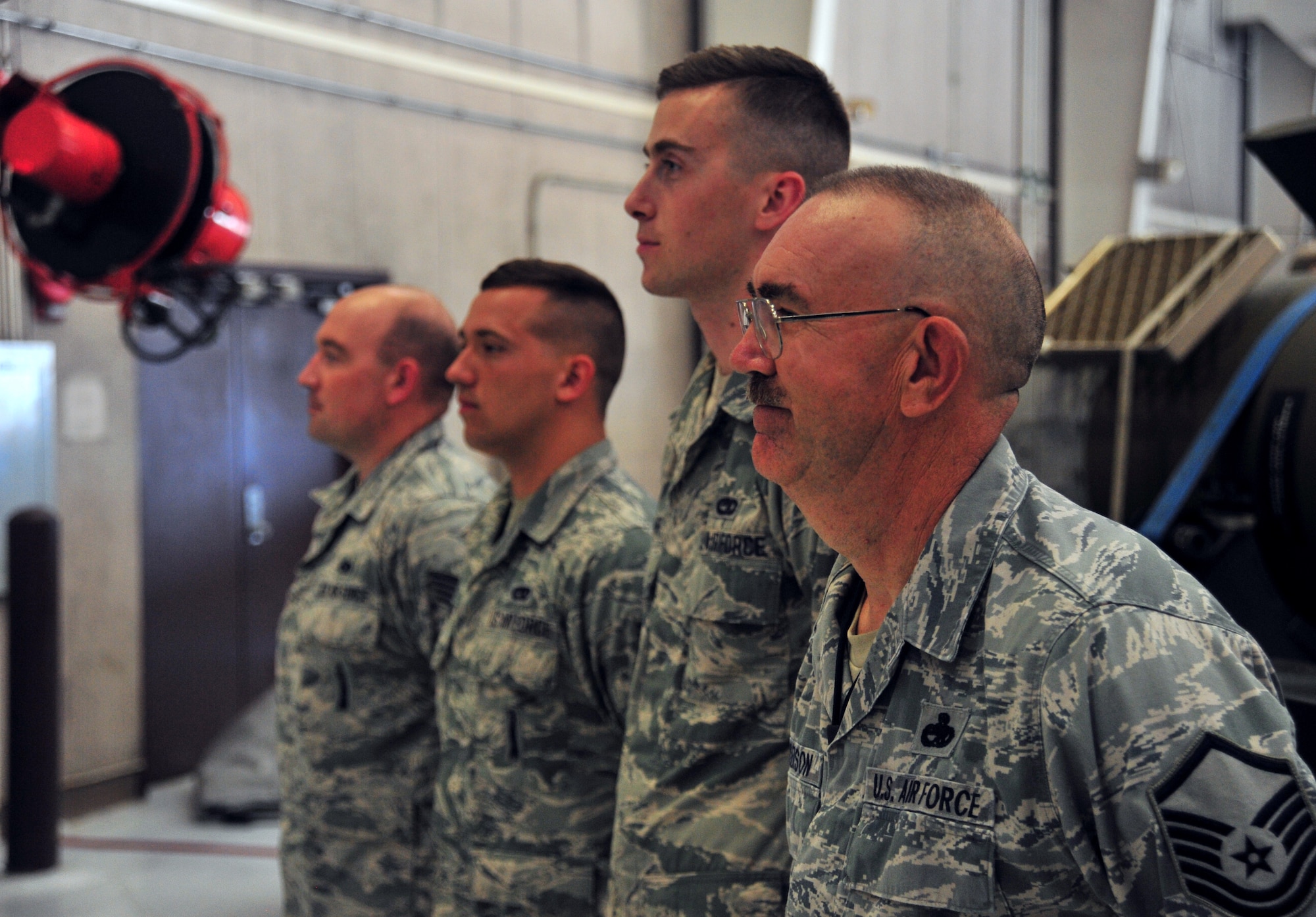 U.S. Air Force Master Sgt. Allen Anderson, an aircraft armament systems mechanic assigned to the 131st Aircraft Maintenance Squadron, stands beside the rest of his load crew prior to certification training at Whiteman Air Force Base, Mo., June 28, 2016. Airmen must be certified on each training munition before being allowed to load it onto aircraft. (U.S. Air Force photo by Senior Airman Jovan Banks)
