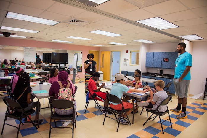 Angela Cottman, 628th Air Base Wing master resilience trainer and BOUNCE instructor, talks to participants of the first resiliency teen camp, named BOUNCE, July 14, 2016 at Joint Base Charleston – Weapons station, S.C., youth center. BOUNCE, which stands for Be optimistic, Observe thoughts, Use strengths, Never give up, Communicate effectively and Embrace you, is a week-long camp designed to teach teens the necessary skills to overcome daily stressors associated to military families. (U.S. Air Force photo/Staff Sgt. Jared Trimarchi)