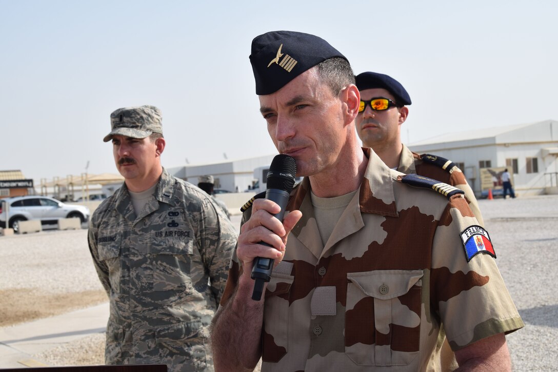 2nd Lt. Emilien Jacquot of the French Air Force narrates the history of French National Day, also known as Bastille Day, July 14, 2016, at Al Udeid Air Base, Qatar. The holiday celebrates Liberty, Equality and Fraternity in France. France is one of 20 nations supporting the air Coalition that provides decisive air and space power to combat Daesh and other terrorist organizations and ensure the stability of the Southwest Asia region. (U.S. Air Force photo/Carlos J. Treviño/Released)
