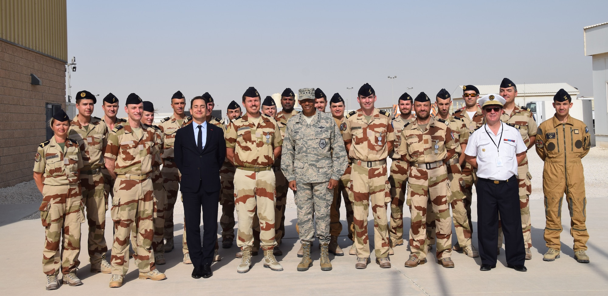 Coalition members from the French Air Force pose for a photo after the Bastille Day ceremony July 14, 2016, at Al Udeid Air Base, Qatar. Monsieur Eric Chevallier, Ambassador of France to Qatar, and Lt. Gen. Charles Brown, U.S. Air Forces Central Command commander, awarded medals to French and U.S. personnel for their support to the 20-member air Coalition. (U.S. Air Force photo/Technical Sgt. Carlos J. Treviño/Released)