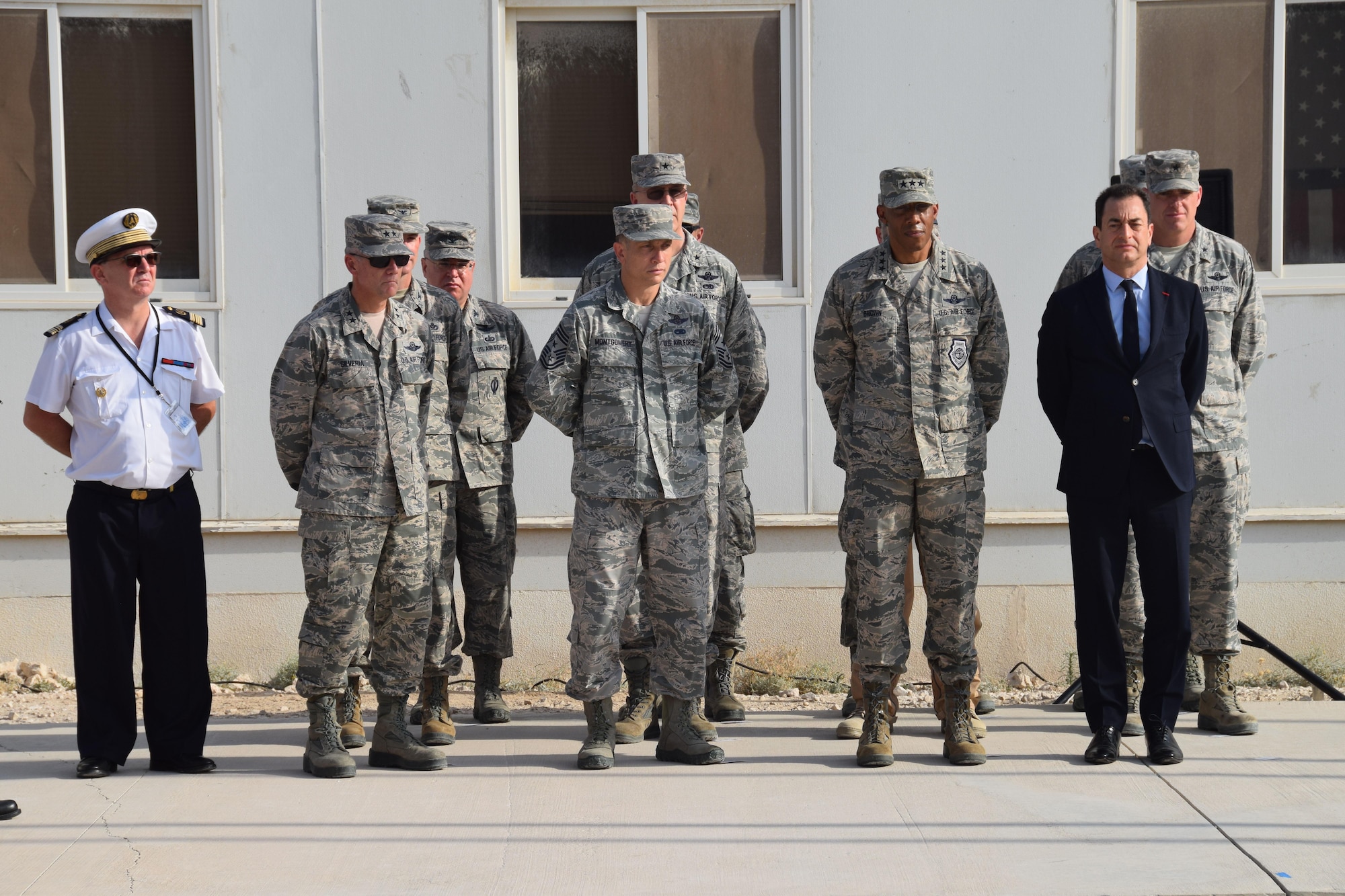 Coalition leaders stand at ease prior to the Bastille Day ceremony July 14, 2016, at Al Udeid Air Base, Qatar. Bastille Day celebrates Liberty, Equality and Fraternity in France. France is one of 20 nations supporting the air Coalition that provides decisive air and space power to combat Daesh and other terrorist organizations and ensure the stability of the Southwest Asia region. (U.S. Air Force photo/Technical Sgt. Carlos J. Treviño/Released)