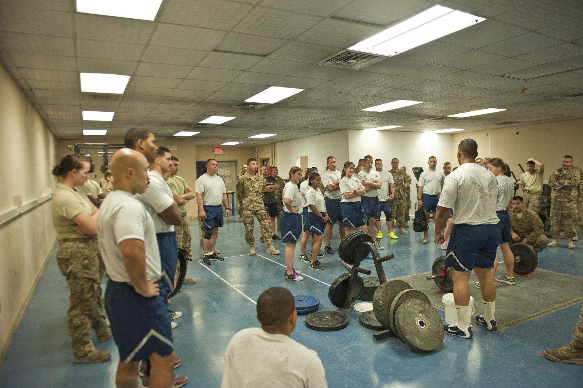 Airmen and civilians are briefed on the deadlift portion of a power lifting competition, July 15, 2016, Bagram Airfield, Afghanistan. The Airmen of the 455th Expeditionary Aircraft Maintenance Squadron organized a power lifting competition as part of events sponsored by the unit activities council. (U.S. Air Force photo by Capt. Korey Fratini)