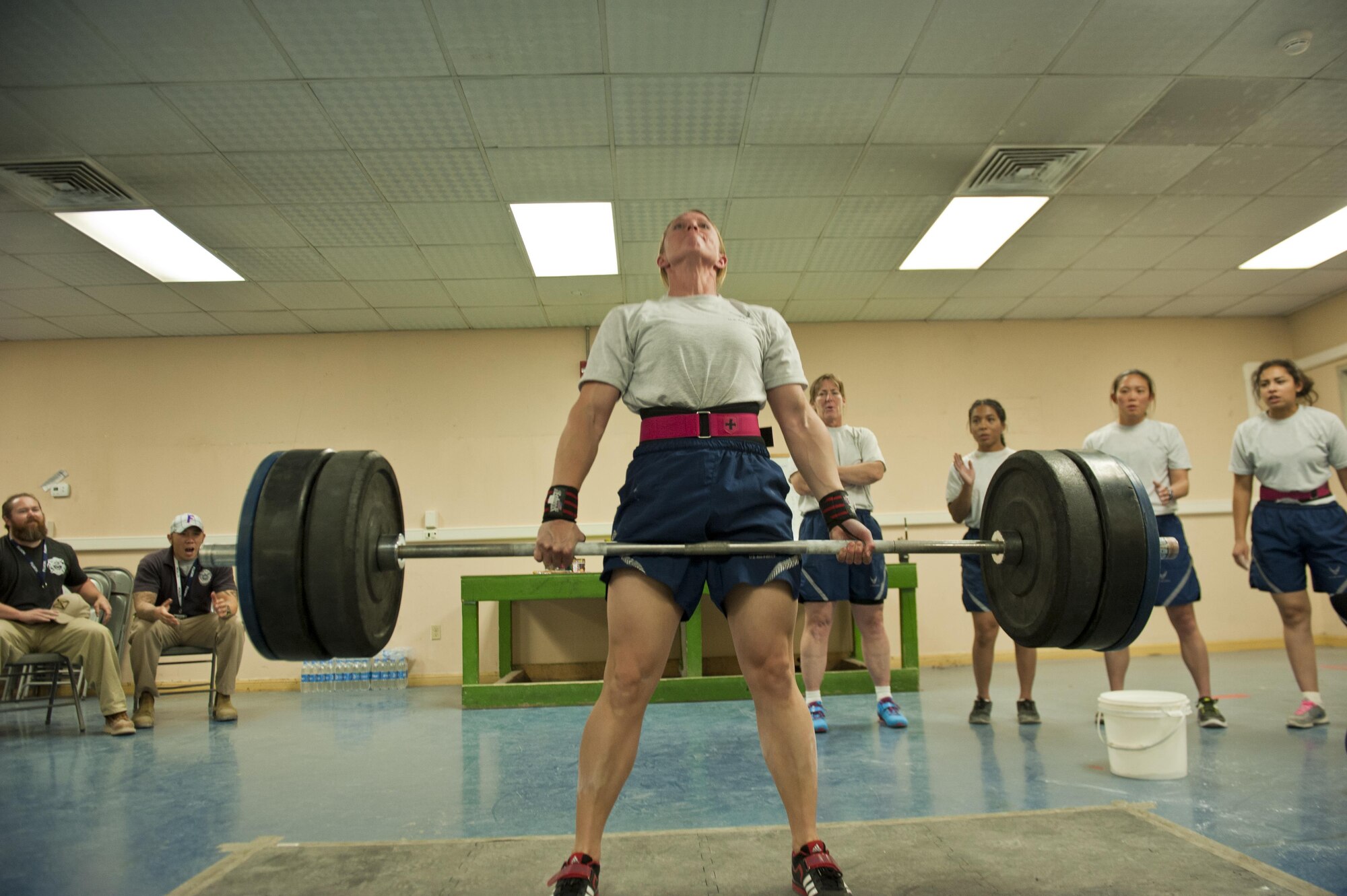 Master Sgt. Lindsey Glover, 455th Expeditionary Aircraft Maintenance Squadron, lifts a barbell while performing a deadlift during a power lifting competition, July 15, 2016, Bagram Airfield, Afghanistan. Glover participated in a power lifting competition that included squats, bench press, and deadlifts organized by the 455th EAMXS. (U.S. Air Force photo by Capt. Korey Fratini)