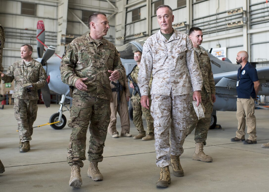 Marine Corps Gen. Joe Dunford, chairman of the Joint Chiefs of Staff, talks with Air Force Brig. Gen. David W. Hicks, commanding general of Train, Advise, Assist Command – Air, while meeting with members of the command in Kabul, Afghanistan, July 16, 2016. DoD photo by Navy Petty Officer 2nd Class Dominique A. Pineiro