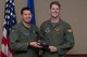 U.S. Air Force Lt. Col. Wade Karren, 11th Bomb Squadron commander, presents the Lindell Mabus Leadership Award to 1st Lt. Stuart Shippee during a Formal Training Unit graduation ceremony, July 15, 2016, Barksdale Air Force Base, La. Shippee was selected by his fellow class members for his exceptional leadership, which was critical to the class's graduation. (U.S. Air Force photo by Master Sgt. Laura Siebert /Released)