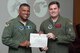 U.S. Air Force, Maj. Gen. Richard Clark, Eighth Air Force commander, presents the Pilot Distinguished Graduate Award to Capt. Christopher Bean during a Formal Training Unit (FTU) graduation ceremony, July 15, 2016, Barksdale Air Force Base, La. Bean graduated from the FTU as a pilot on the B-52H Stratofortress. (U.S. Air Force photo by Master Sgt. Laura Siebert /Released)