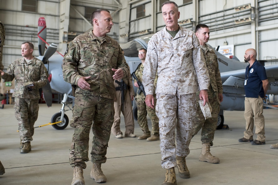 Marine Corps Gen. Joe Dunford, chairman of the Joint Chiefs of Staff, talks with Air Force Brig. Gen. David W. Hicks, commanding general of Train, Advise, Assist Command – Air, while meeting with members of the command at Bagram Airfield, Afghanistan.