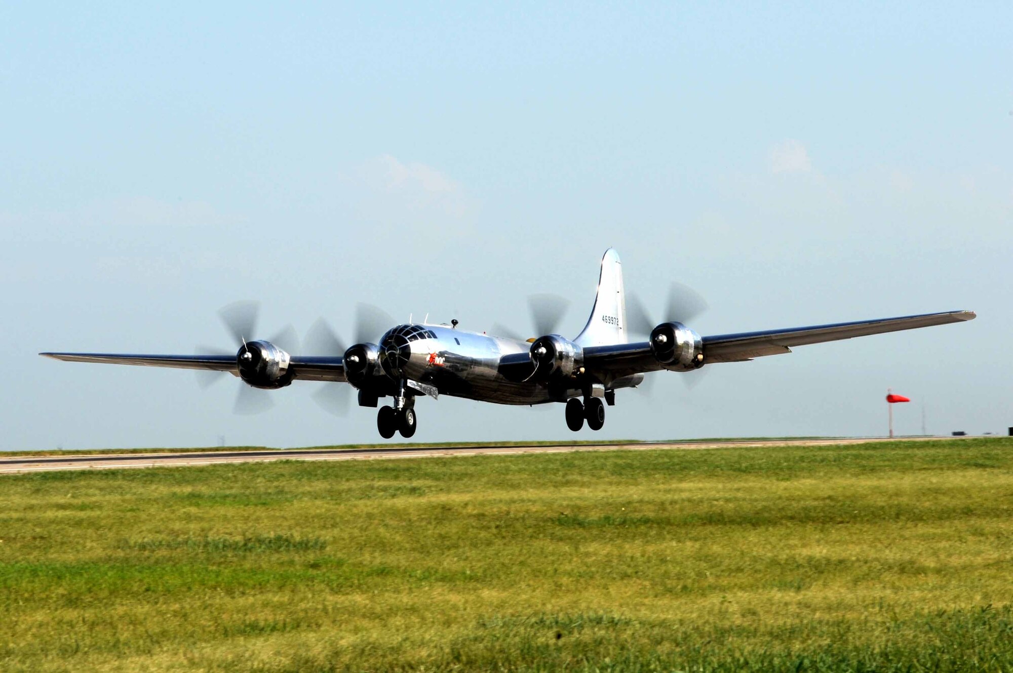A B-29 Superfortress, known as ‘Doc,’ takes off for the first time in approximately 60 years, July 17, 2016, at McConnell Air Force Base, Kan. A restoration team worked on the aircraft for the last 16 years to prepare it for flight. (U.S Air Force photo/Airman 1st Class Jenna Caldwell)