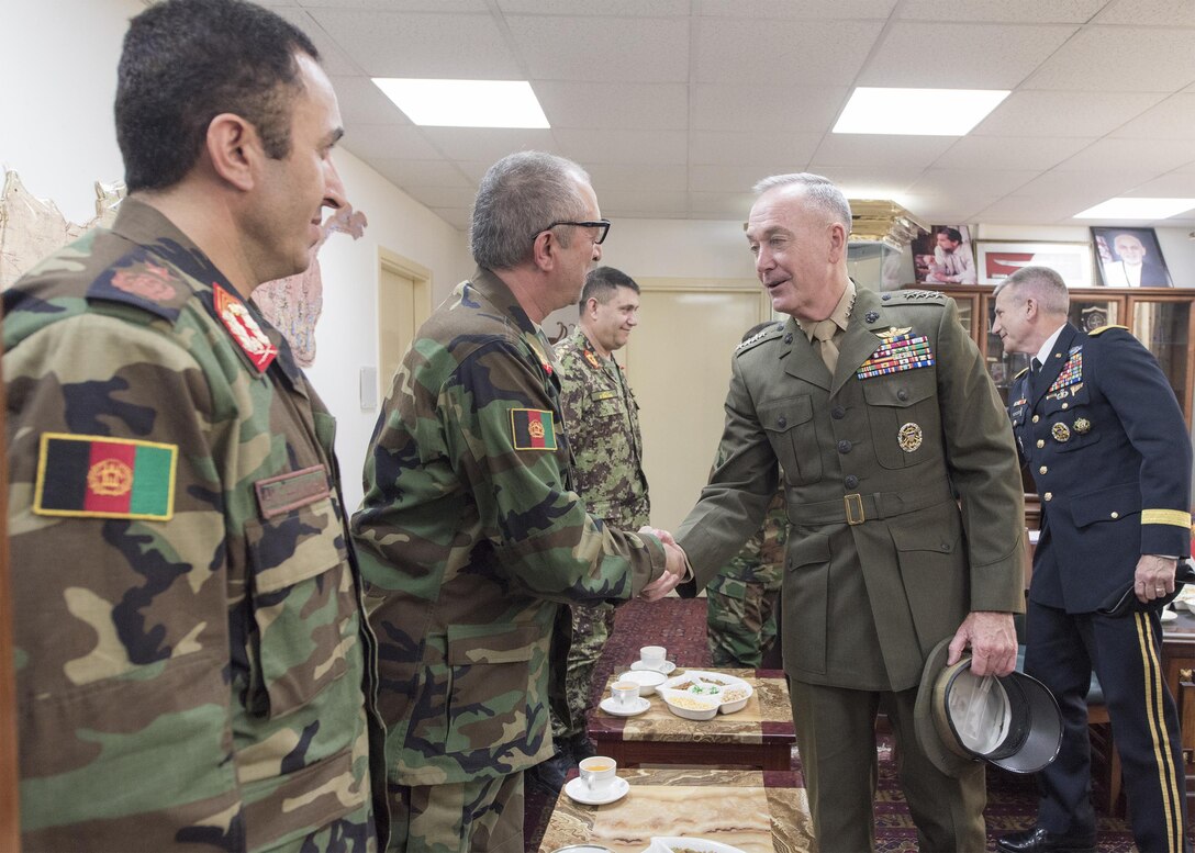 Marine Corps Gen. Joe Dunford, chairman of the Joint Chiefs of Staff, meets members of the staff of Afghan Gen. Qadam Shah Shahim, Afghanistan’s chief of defense, at the Ministry of Defense in Kabul, Afghanistan, July 17, 2016. DoD photo by Navy Petty Officer 2nd Class Dominique A. Pineiro