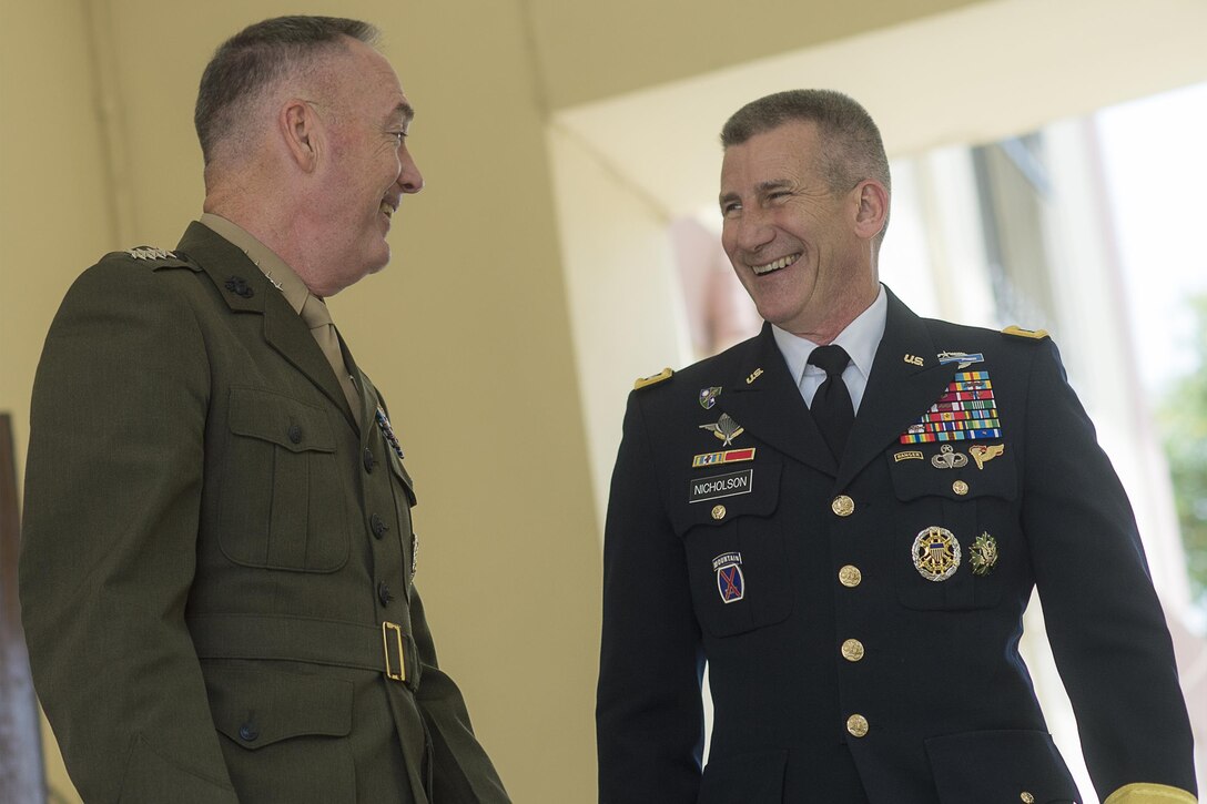 Marine Corps Gen. Joe Dunford, chairman of the Joint Chiefs of Staff, shares a light moment with Army Gen. John W. Nicholson Jr., commander of the Resolute Support mission and U.S. Forces Afghanistan, at Resolute Support headquarters Kabul, Afghanistan, July 17, 2016. DoD photo by Navy Petty Officer 2nd Class Dominique A. Pineiro