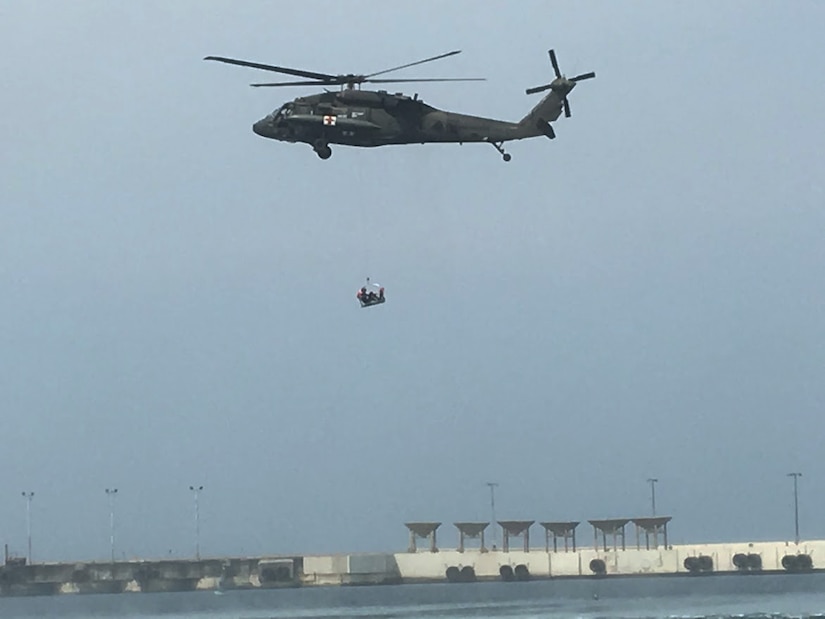 Members of the 1st Battalion, 228th Aviation Regiment from Joint Task Force-Bravo conduct open water rescue training with Salvadorian military using an HH-60 Black Hawk Medical Evacuation helicopter May 26 in El Salvador. JTF-Bravo and other U.S. Military elements such as U.S. Army South Regionally Aligned Forces and Special-Purpose Marine Air, Ground Task Forces, under the auspices of U.S. Southern Command, routinely conduct combined training and exercises with Partner Nation security forces in multiple Central American nations, improving the safety and security in the CENTAM region and southern approaches to the United States. (Courtesy Photo)