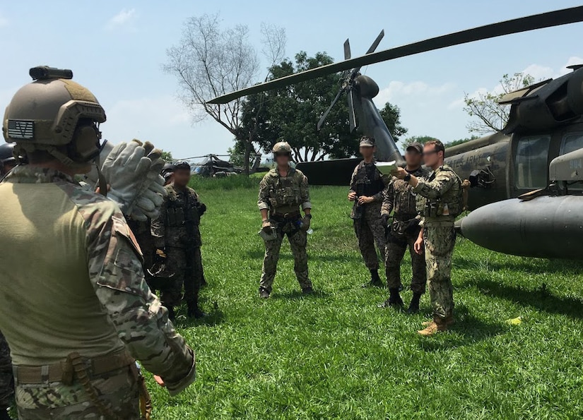 Members of the 1st Battalion, 228th Aviation Regiment from Joint Task Force-Bravo and Special Operations Command South conduct aircraft familiarization training on a UH-60 Black Hawk helicopter with Salvadorian military May 24 in El Salvador. JTF-Bravo and other U.S. Military elements such as U.S. Army South Regionally Aligned Forces and Special-Purpose Marine Air, Ground Task Forces, under the auspices of U.S. Southern Command, routinely conduct combined training and exercises with Partner Nation security forces in multiple Central American nations, improving the safety and security in the CENTAM region and southern approaches to the United States. (Courtesy Photo  Illustration)