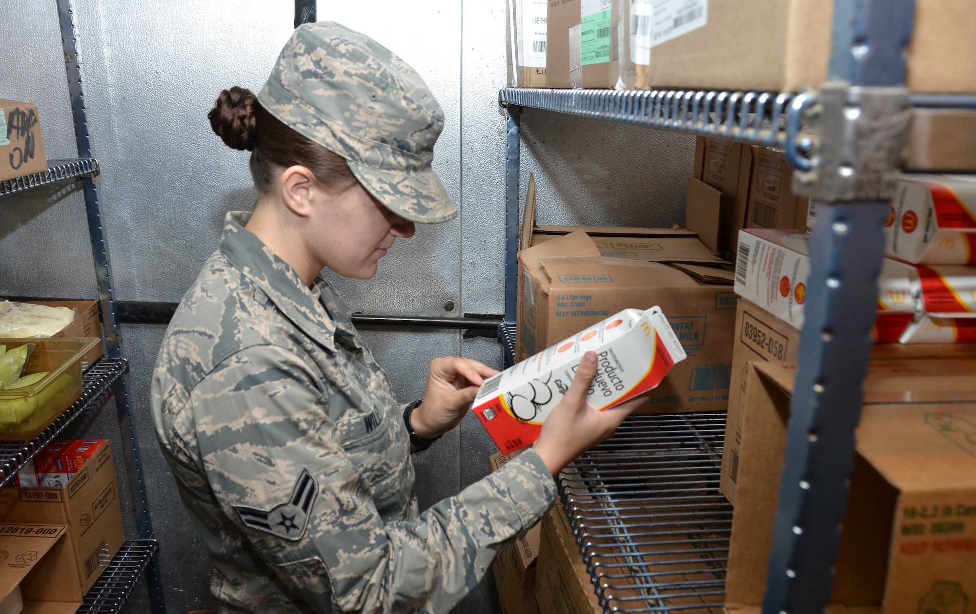 Airman 1st Class Taylor Wiley, preventative medicine, 117th Medical Group, verifies food served at Naval Medical Center San Diego is safe for consumption in San Diego, Calif., June 28, 2016.  The 117 MDG trained with the U.S. Navy at Naval Medical Center San Diego.  The training included Airmen being implemented in real world U.S. Naval operations.  (U.S. Air National Guard photo by Staff Sgt. Jeremy Farson/Released)   