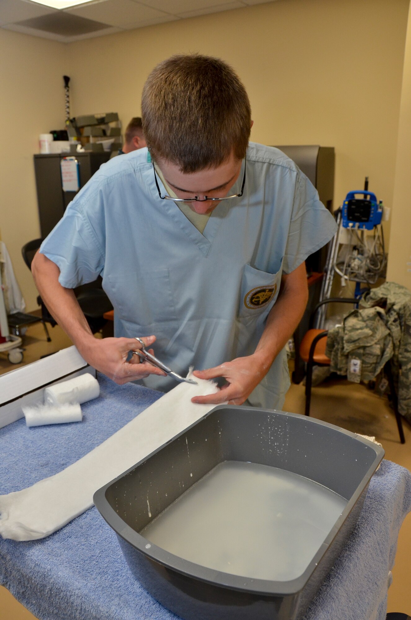 Tech. Sgt. Eric B. Simmons, medical technician, 117th Medical Group, prepares to make a cast at Naval Medical Center San Diego, in San Diego, Calif., June 29, 2016.  The 117 MDG trained with the U.S. Navy at Naval Medical Center San Diego.  The training included Airmen being implemented in real world U.S. Naval operations.  (U.S. Air National Guard photo by Staff Sgt. Jeremy Farson/Released)   