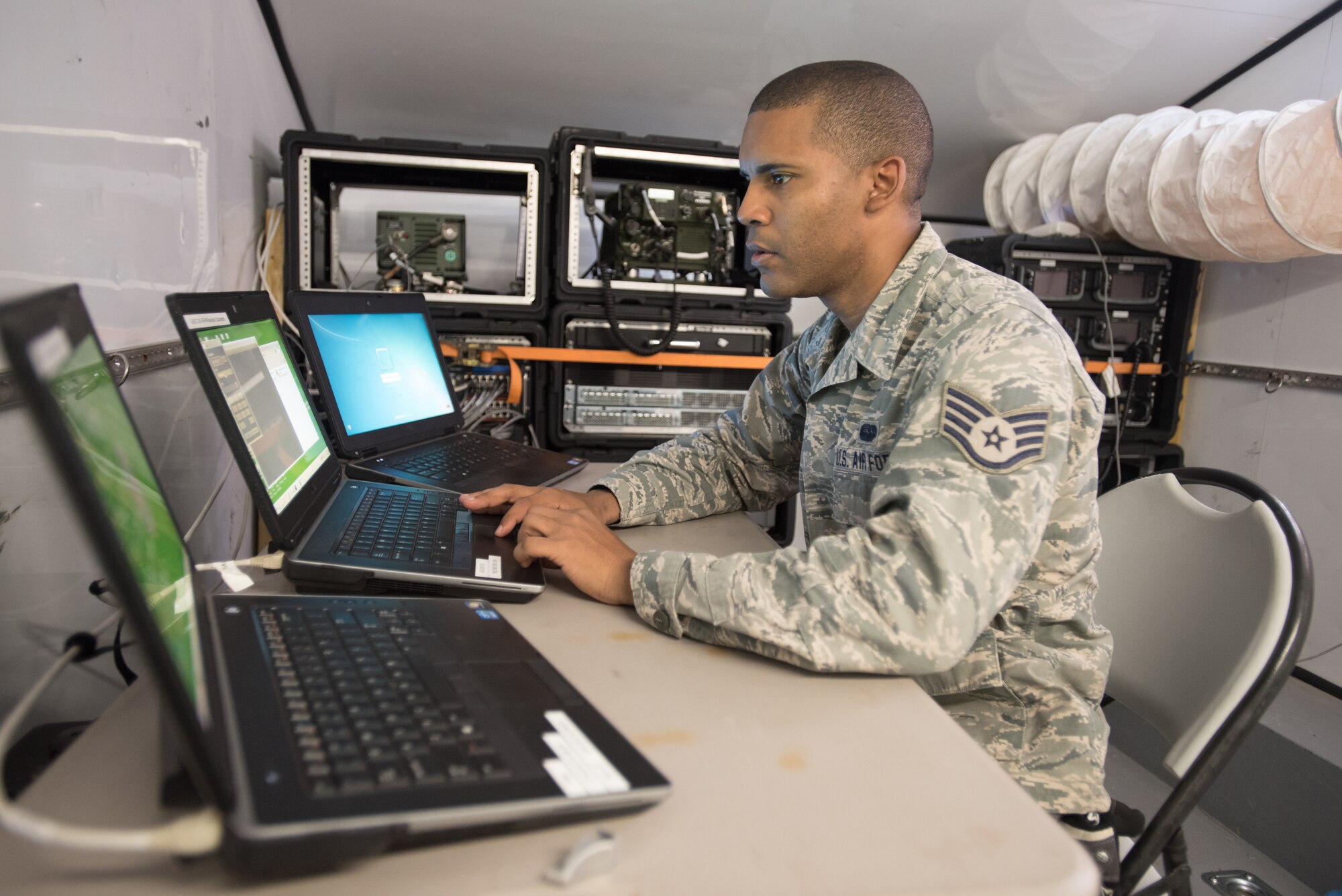 Staff Sgt. Jose Romero, a cyber systems operations technician for the Puerto Rico Air National Guard’s 156th Airlift Wing, sets up satellite communications at Paducah Tilghman High School in Paducah, Ky., July 16, 2016, in preparation for Bluegrass Medical Innovative Readiness Training. The program will offer medical and dental care at no cost to residents in three Western Kentucky locations from July 18 to 27. (U.S. Air National Guard photo by Master Sgt. Phil Speck)