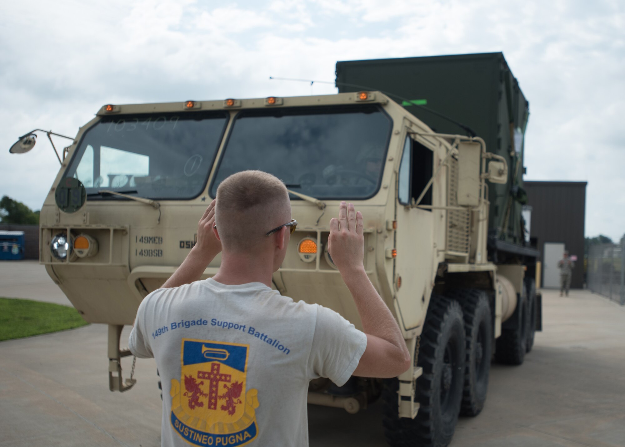 Kentucky Army National Guard Sgt. Joseph Foriest, a transportation specialist for the 149th Brigade Support Battalion, directs a U.S. Army Load Handling System at Barkley Regional Airport in Paducah, Ky., July 14, 2016, in preparation for Bluegrass Medical Innovative Readiness Training. The program will offer medical and dental care at no cost to residents in three Western Kentucky locations from July 18 to 27. (U.S. Air National Guard photo by Master Sgt. Phil Speck)