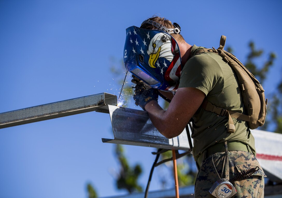 U.S. Marine Lance Cpl. Jamest J. Tedder, metal worker with Task Force Koa Moana 16.2, conducts vertical construction training at Ovalau, Fiji, July 12, 2016. Fiji is part of Task Force Koa Moana’s deployment throughout the Asia-Pacific region where Marines and Sailors will share engineering and infantry skills with the Republic of Fiji Military Forces to strengthen mil-to-mil relationships and interoperability. (U.S. Marine Corps imagery by MCIPAC Combat Camera Lance Cpl. Jesus McCloud/ Released)