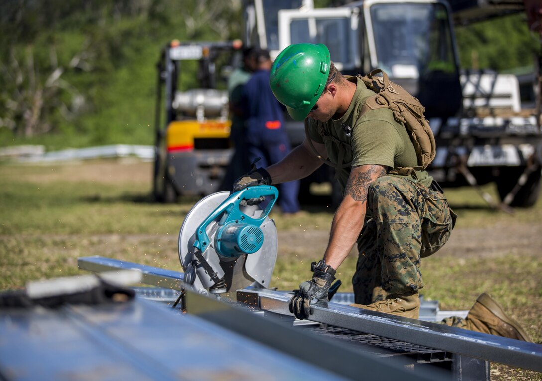 U.S. Marine Cpl. Derek C. Brisendine, combat engineer with task Force Koa Moana 16.2, cuts steel for vertical construction training at Ovalau, Fiji, July 12, 2016. Fiji is part of Task Force Koa Moana’s deployment throughout the Asia-Pacific region where Marines and Sailors will share engineering and infantry skills with the Republic of Fiji Military Forces to strengthen mil-to-mil relationships and interoperability. (U.S. Marine Corps imagery by MCIPAC Combat Camera Lance Cpl. Jesus McCloud/ Released)