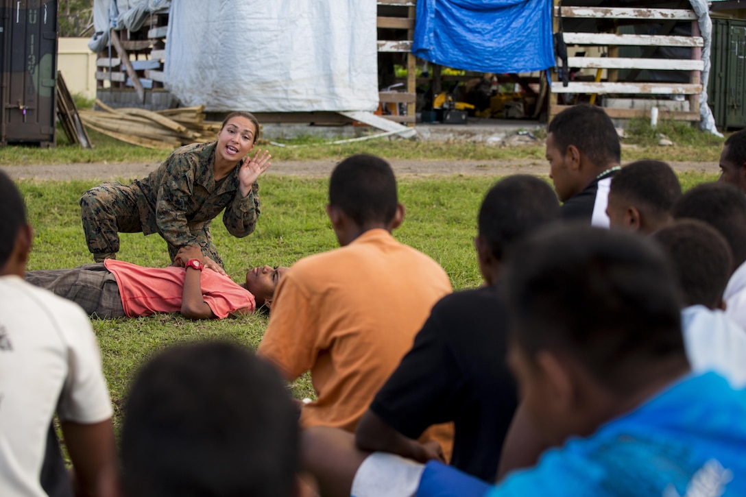 U.S. Navy Petty Officer 3rd Class Kirra Senne, Hospital Corpsman with Task Force Koa Moana 16.2, leads small instructions on general health and wellness to local youth at St. John’s College, Ovalau, Fiji, July 12, 2016. Fiji is part of Task Force Koa Moana’s deployment throughout the Asia-Pacific region where Marines and Sailors will share engineering and infantry skills with the Republic of Fiji Military Forces to strengthen mil-to-mil relationships and interoperability. (U.S. Marine Corps imagery by MCIPAC Combat Camera Lance Cpl. Jesus McCloud/ Released)