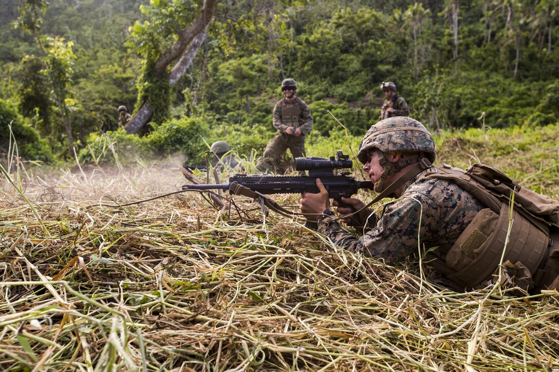 U.S. Marine Lance Cpl. Abraham Aaron with Task Force Koa Moana 16.2 fires rounds down range while conducting integrated fire-team buddy rushes with Soldiers from the Republic of Fiji Military Forces on Ovalau, Fiji, July 13, 2016. Fiji is part of Task Force Koa Moana’s deployment throughout the Asia-Pacific region, where Marines and Sailors will share engineering and infantry skills with the RFMF to strengthen mil-to-mil relationships and interoperability. (U.S. Marine Corps imagery by MCIPAC Combat Camera Lance Cpl. Jesus McCloud/ Released)
