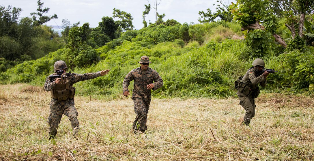 U.S. Marine Lance Cpl. Noah A. Bigbee, with Task Force Koa Moana 16.2, and Republic of Fiji Military Forces Pvt. Iliesa Naqovu conduct integrated fire-team buddy rushes on Ovalau, Fiji, July 13, 2016. Fiji is part of Task Force Koa Moana’s deployment throughout the Asia-Pacific region, where Marines and Sailors will share engineering and infantry skills with the RFMF to strengthen mil-to-mil relationships and interoperability. (U.S. Marine Corps imagery by MCIPAC Combat Camera Lance Cpl. Jesus McCloud/ Released)