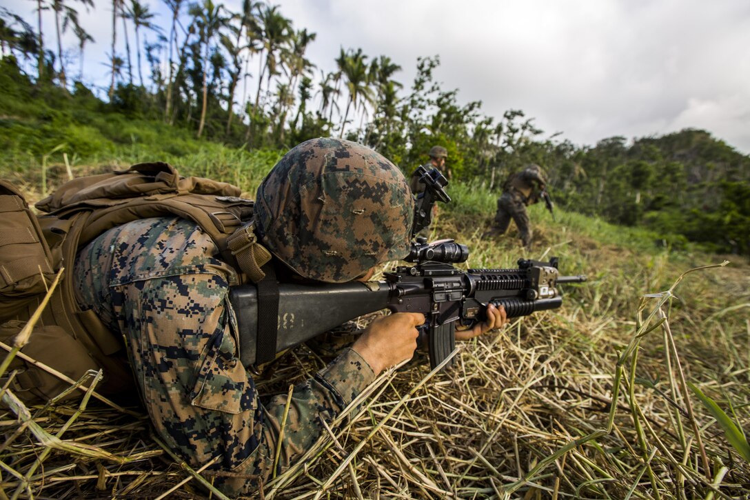 U.S. Marine Cpl. Jacob W. Anderson with Task Force Koa Moana 16.2 fires rounds down range while conducting integrated fire-team buddy rushes with Soldiers from the Republic of Fiji Military Forces on Ovalau, Fiji, July 13, 2016. Fiji is part of Task Force Koa Moana’s deployment throughout the Asia-Pacific region, where Marines and Sailors will share engineering and infantry skills with the RFMF to strengthen mil-to-mil relationships and interoperability. (U.S. Marine Corps imagery by MCIPAC Combat Camera Lance Cpl. Jesus McCloud/ Released)