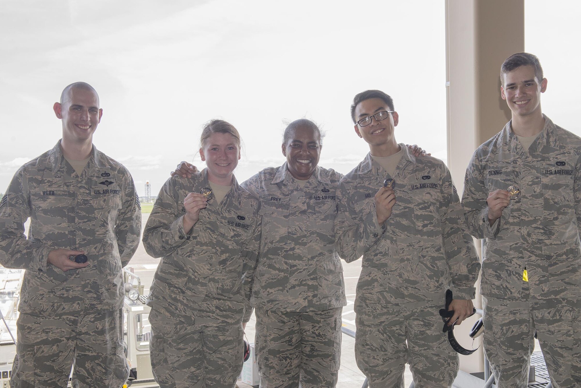 Chief Master Sgt. Shelina Frey, Air Mobility Command command chief, poses for a photo with Airmen assigned to the 730th Air Mobility Squadron at Yokota Air Base, Japan, July 10, 2016. Frey toured 730 AMS facilities alongside Gen. Carlton Everhart, AMC commander, during his 515th Air Mobility Operations Wing Pacific visit. (U.S. Air Force photo by Senior Airman David C. Danford/Released)