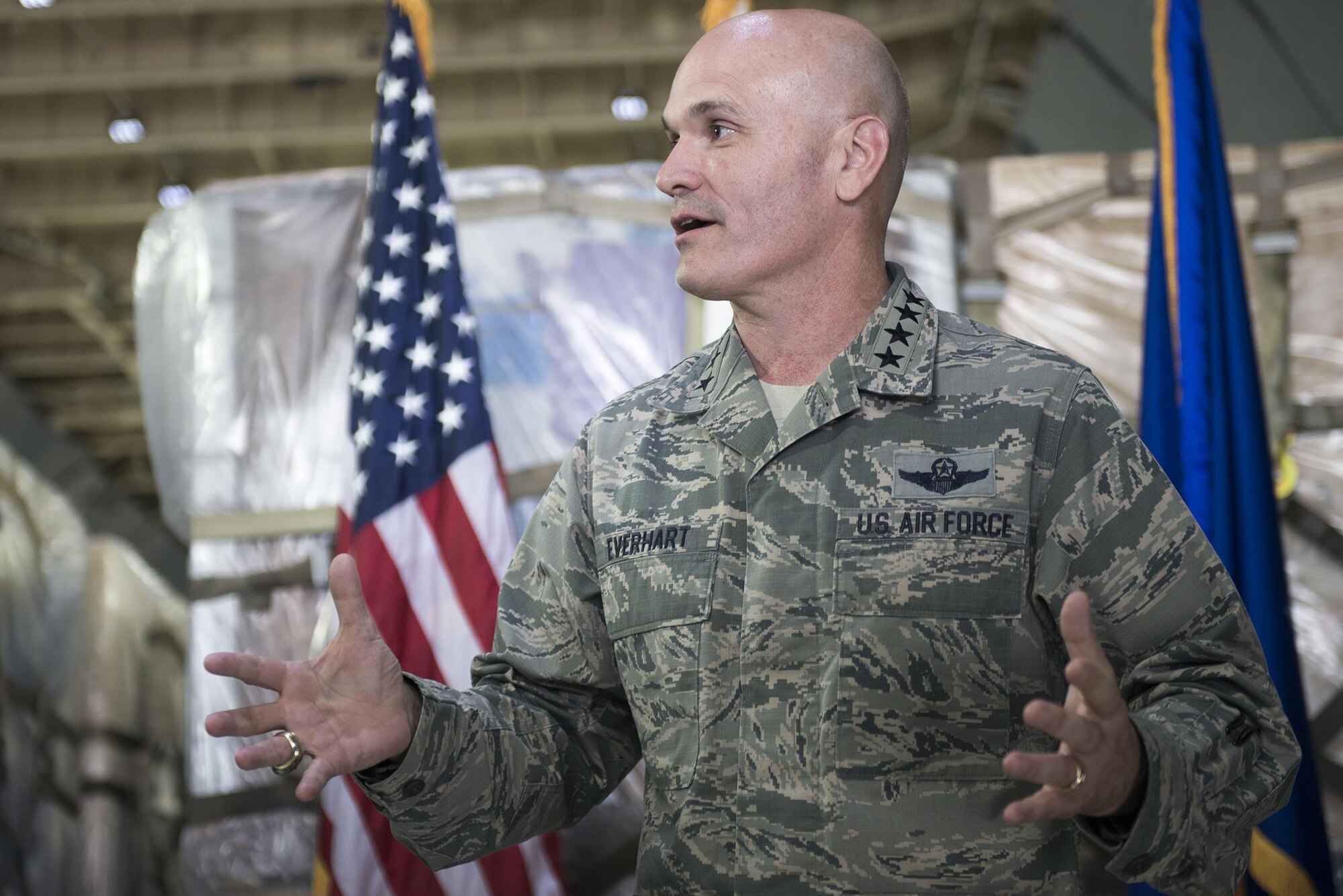 Gen. Carlton Everhart, Air Mobility Command commander, presides over the promotion ceremony for 1st Lt. Molly Sparks, 730th Air Mobility Squadron executive officer, at Yokota Air Base, Japan, July 11, 2016. The ceremony was held onboard a C-5M Super Galaxy. (U.S. Air Force photo by Senior Airman David C. Danford/Released)