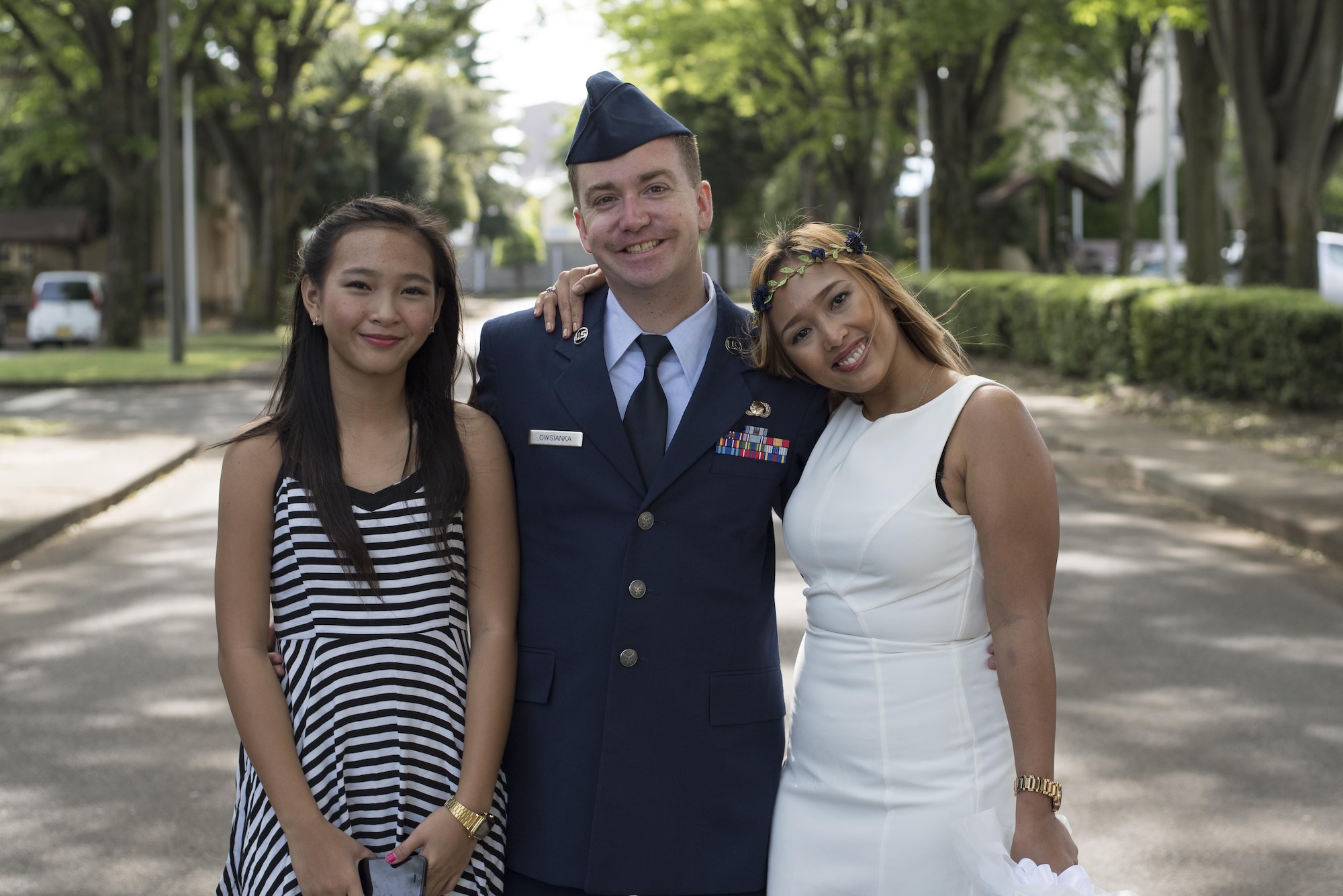 Joheart (right), Toni (left) and Senior Airman David Owsianka (center), 374th Airlift Wing Public Affairs photojournalist, pose for a picture at Yokota Air Base, Japan, May 7, 2016. (U.S. Air Force photo by Staff Sgt. Michael Washburn/Released)
