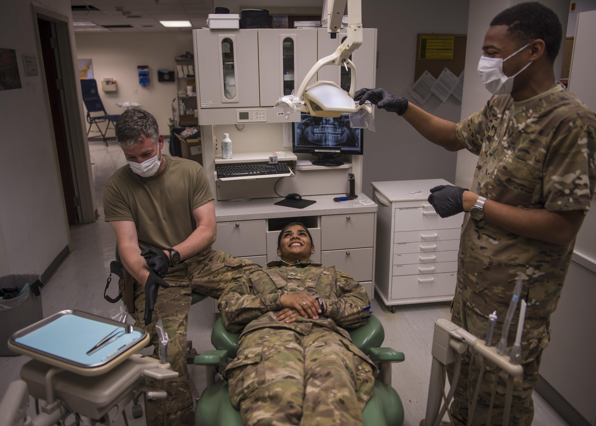 U.S. Army Capt John Mann, 129th Area Support Medical Company dentist, prepares dental instruments for an exam, Bagram Airfield, Afghanistan, July 16, 2016. Dental technicians perform oral cleanings, prepare dental instruments and assist dentists with procedures. (U.S. Air Force photo by Senior Airman Justyn M. Freeman)