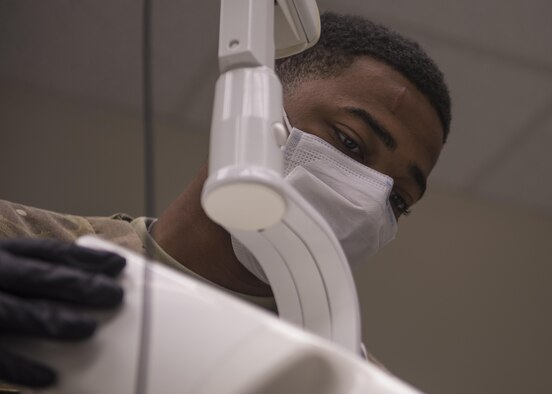 U.S. Army Specialist Anfernee Grant, 129th Area Support Medical Company dental technician, prepares a periapical X-ray device, Bagram Airfield, Afghanistan, July 16, 2016. X-rays are used as a tool to help detect decay or abscess in the root of the gums. (U.S. Air Force photo by Senior Airman Justyn M. Freeman)