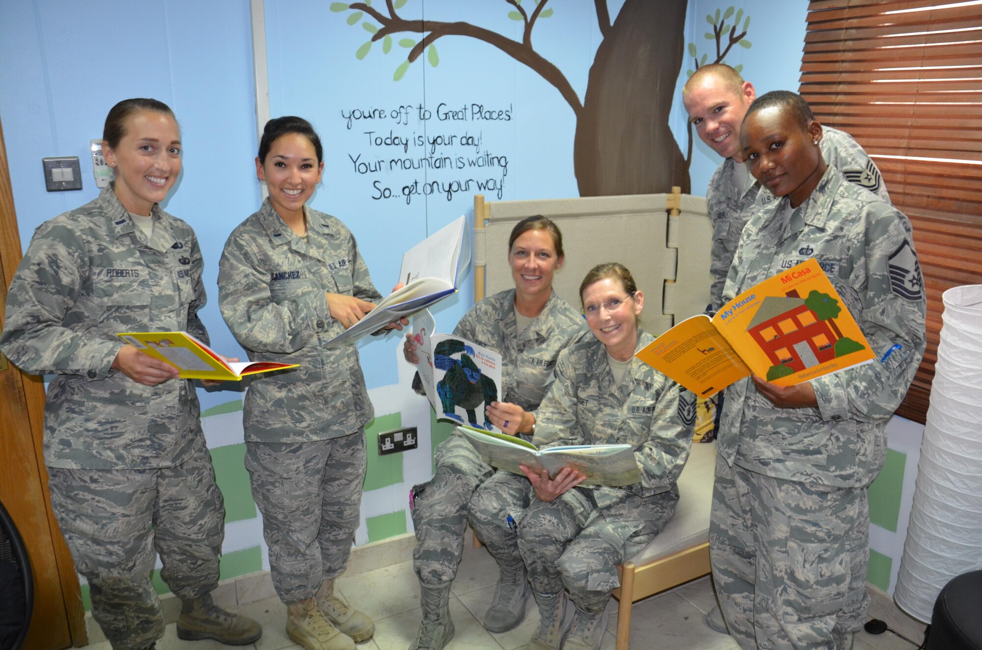 These 386th Air Expeditionary Wing Airmen took part in the effort to renovate the reading room at the Wired, which now provides deployed parents an opportunity to read to their children. The Airmen are, from left to right, 1st Lt. Crystal Roberts, 1st Lt. Alexis Sanchez, Tech. Sgt. Nisha Hurst, Master Sgt. Jan Bridget, Tech. Sgt. Stentsen Ellenburg, and Master Sgt. Shellise Epps. (U.S. Air Force photo/Capt. Philip Cortez)