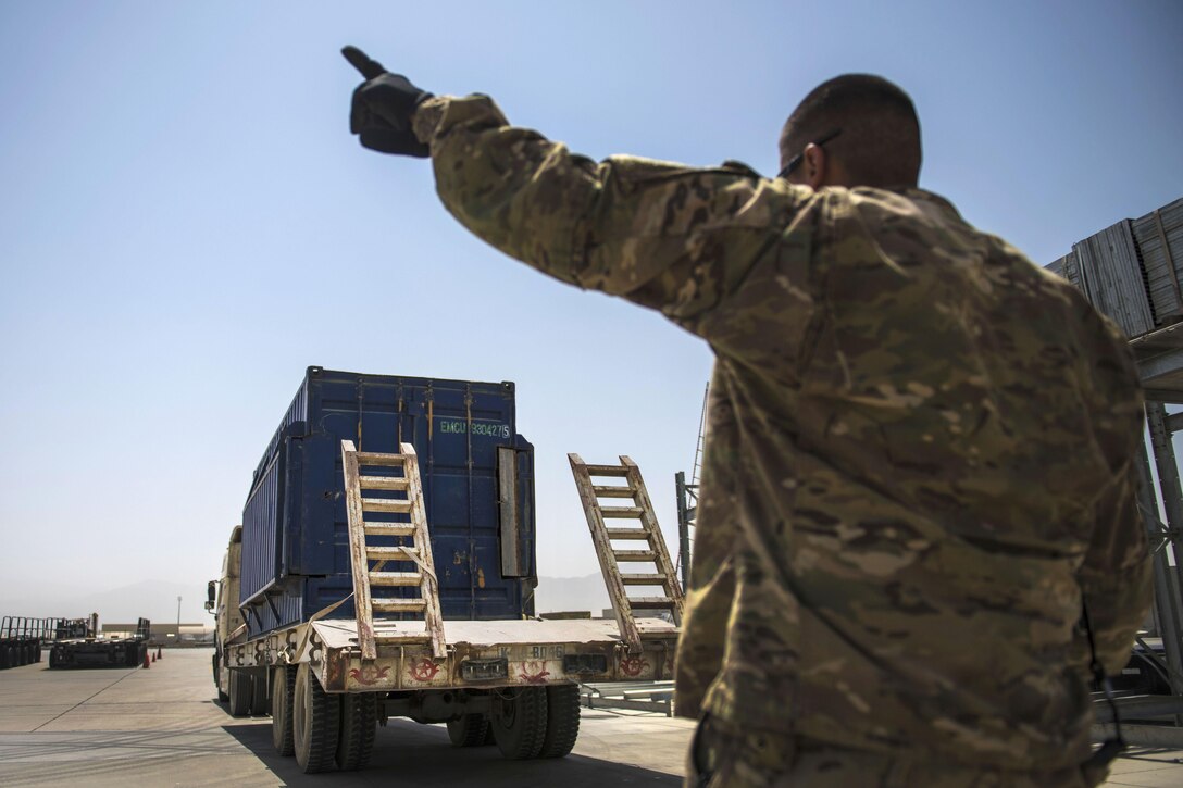 Air Force Staff Sgt. Jacob Chavez guides a delivery truck at Bagram Airfield, Afghanistan, July 14, 2016. Chavez is a material recovery specialist assigned to the 455th Expeditionary Logistics Readiness Squadron Central Command. Air Force photo by Senior Airman Justyn M. Freeman