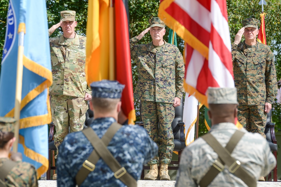 Army Gen. David M. Rodriguez, outgoing commander of U.S. Africa Command; Marine Corps Gen. Joe Dunford, chairman of the Joint Chiefs of Staff, and Marine Corps Gen. Thomas D. Waldhauser, incoming commander of U.S. Africa Command, salute a joint color guard during the change-of-command ceremony at U.S. Army Garrison Stuttgart, Germany, July 18, 2016. DoD photo by Jason Johnston